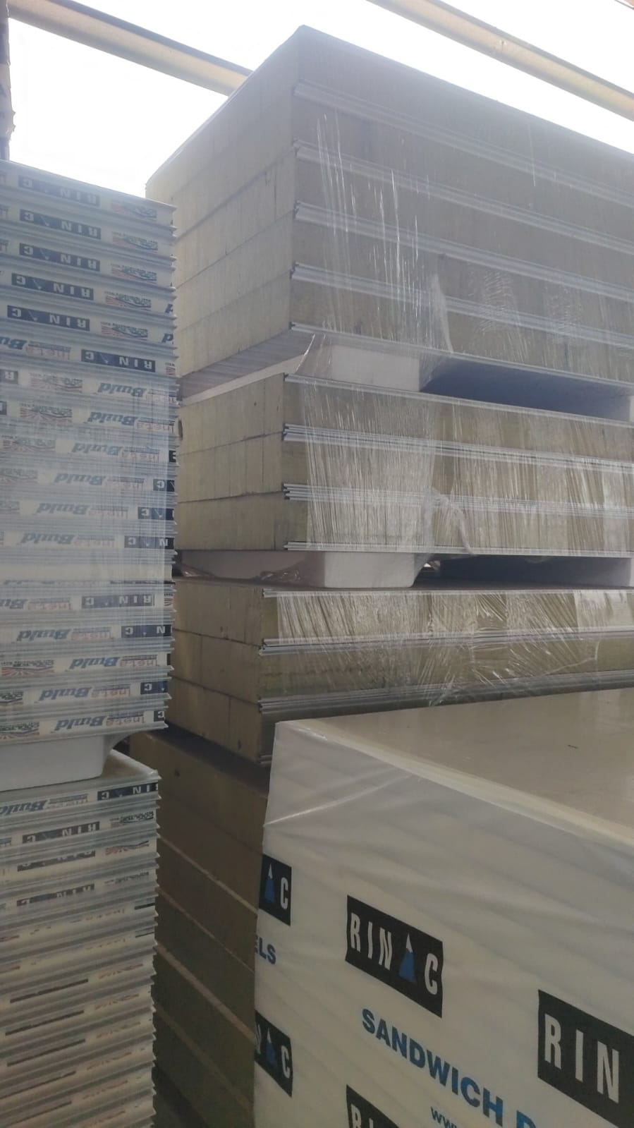 Rinac branded insulated sandwich panels packaged and ready for delivery