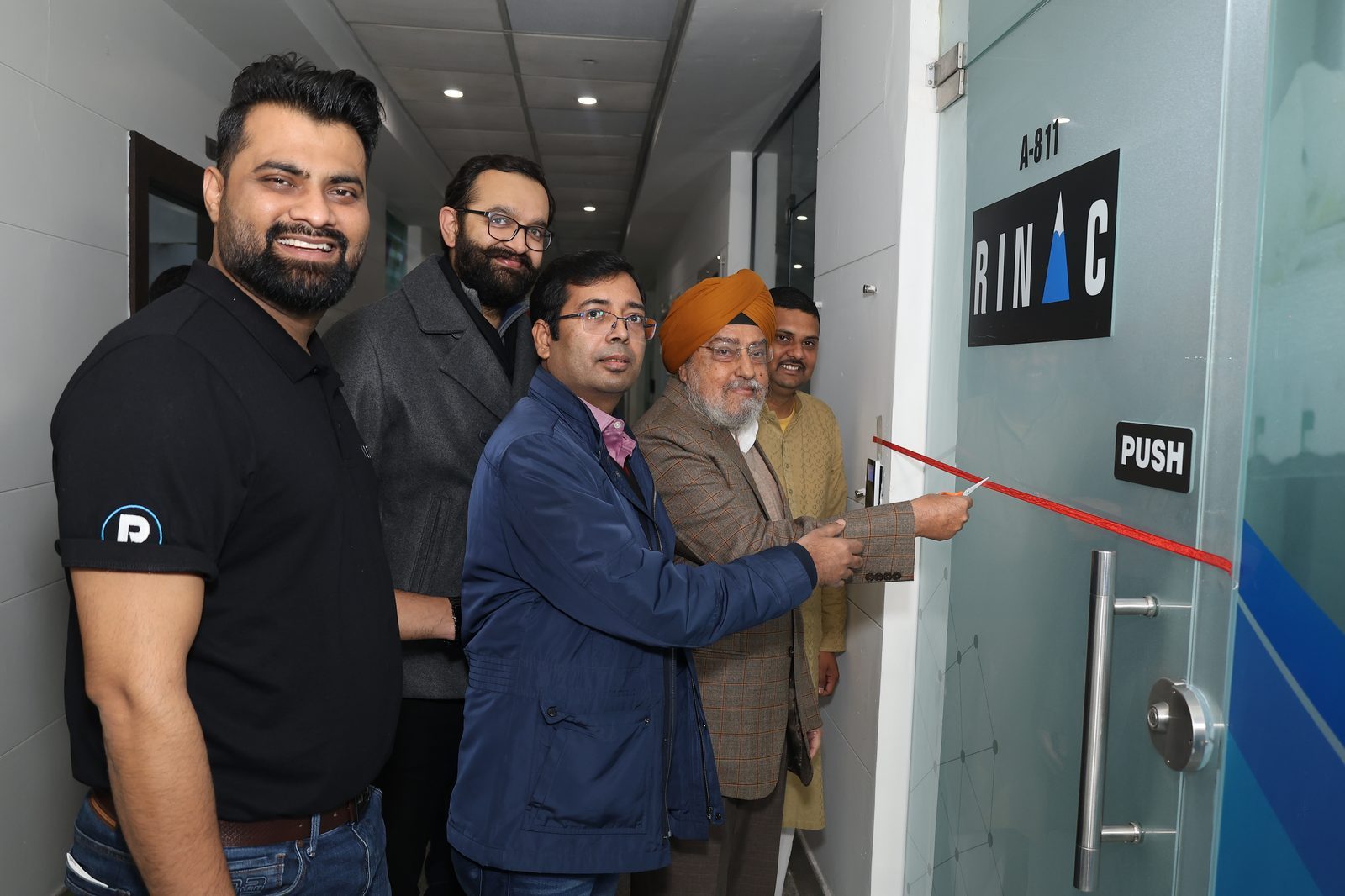 Rinac Chandigarh office inauguration — ribbon cutting at door A-811